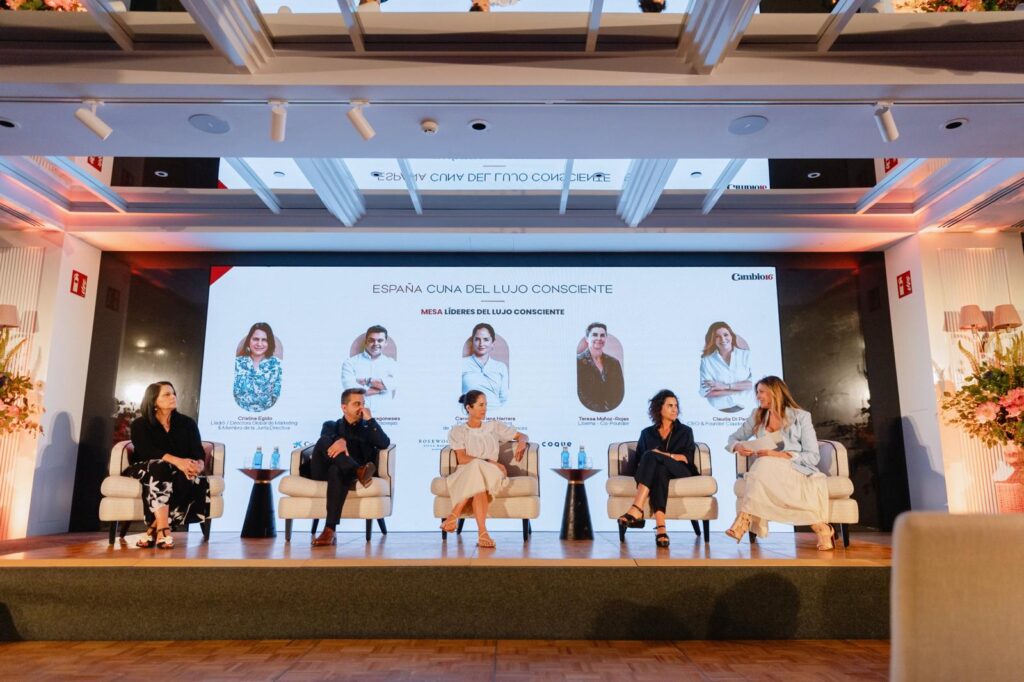 panel of industry leaders discussing conscious luxury and sustainability at the spain cradle of conscious luxury event in madrid with ark architects participation.