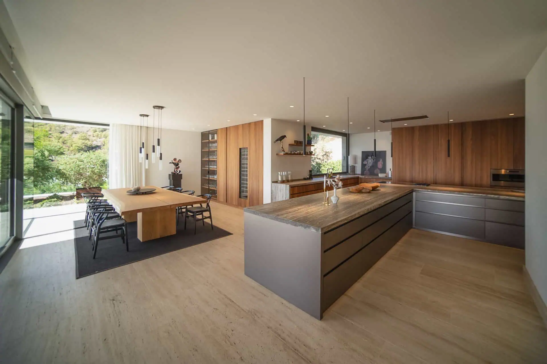 Bright ARK Architects kitchen and dining area, highlighting the importance of natural light, texture, and openness to enhance the sensory experience.