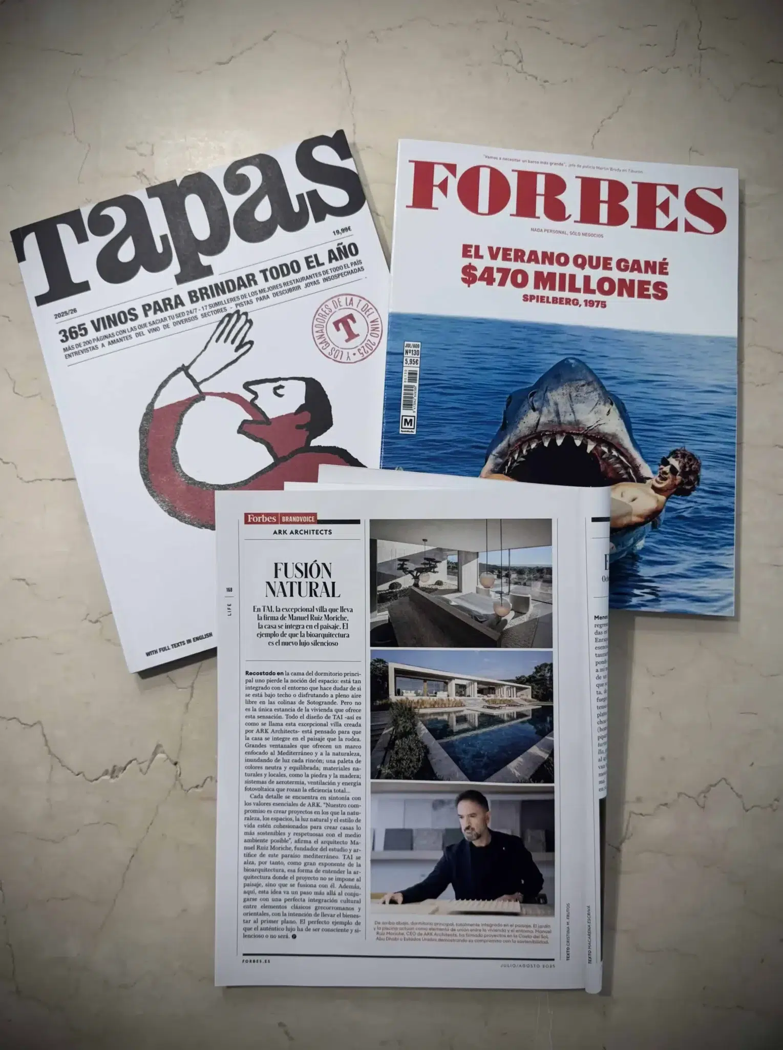 printed magazines Tapas and Forbes featuring Villa TAI by ARK Architects, highlighting the concept of design fusion