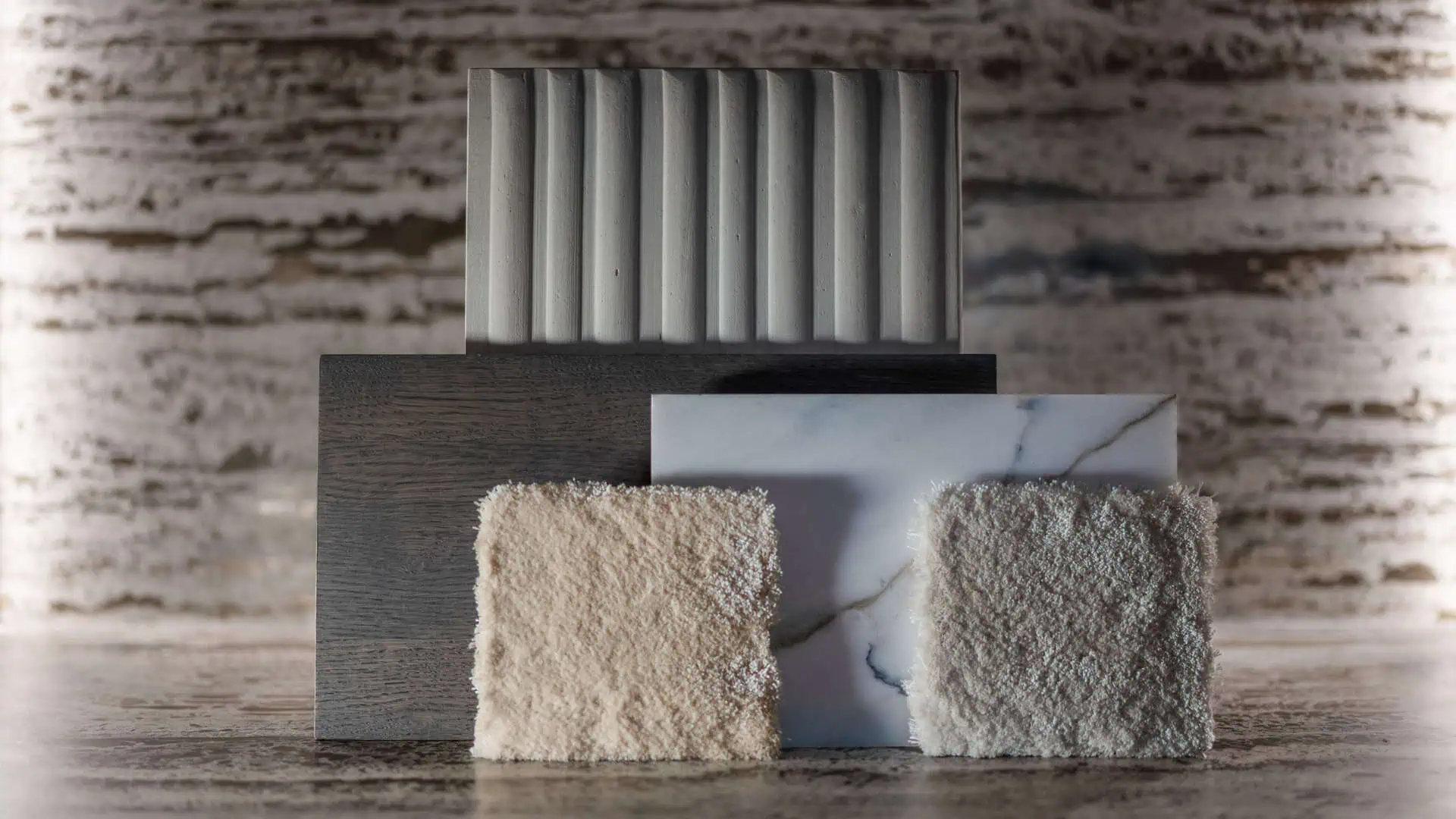 ark architects close up of marble wood and fabric samples arranged for a luxury villa palette